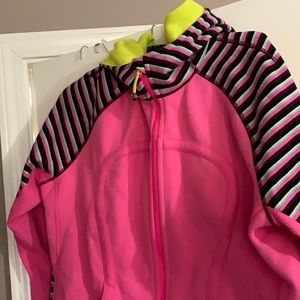 Lululemon pink NWT Scuba Hoodie Stretch. Striped arms,yellow lined hood.
